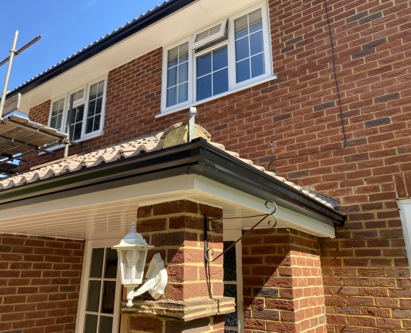 White Fascias and Soffits with Black Seamless Aluminium Gutters in Leatherhead Surrey 2