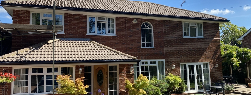 White Fascias and Soffits with Black Seamless Aluminium Gutters in Leatherhead Surrey 3